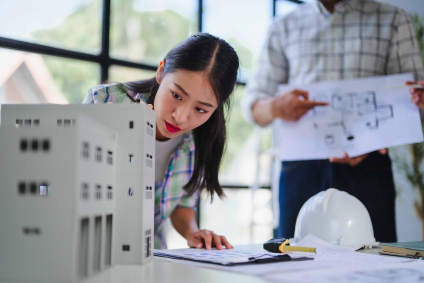 architects-analyzing-building-model-and-blueprints-2026-01-08-22-35-35-utc_2